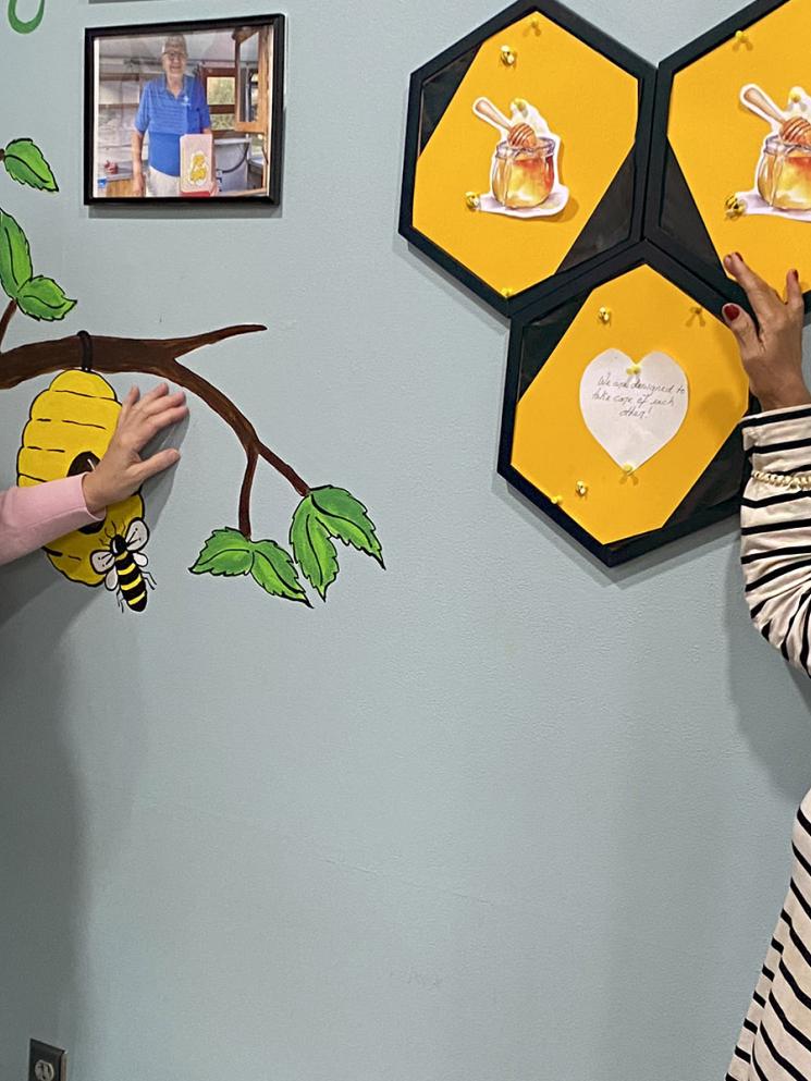 People hanging wall decorations