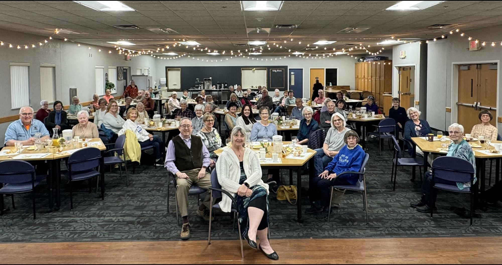 Many people seated at tables
